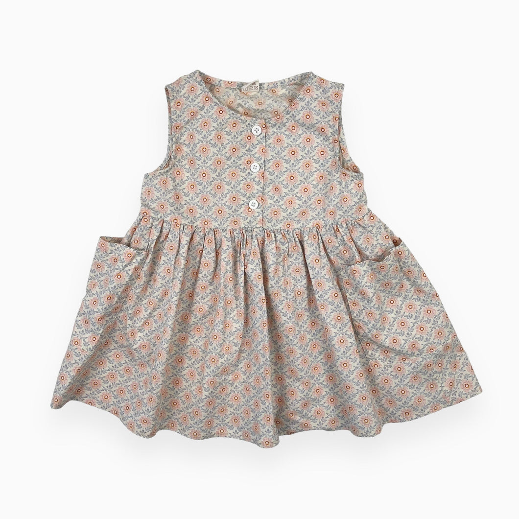 Robe fleurie en fin coton avec poches et demi boutonnière 18-24M